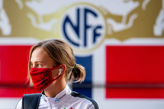 Caroline Graham Hansen of Norway arrives wearing a face mask