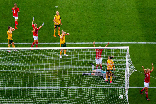 Players of Wales look dejected as goalkeeper Laura