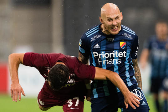 Mihai Bordeianu of CFR Cluj and Magnus Eriksson of