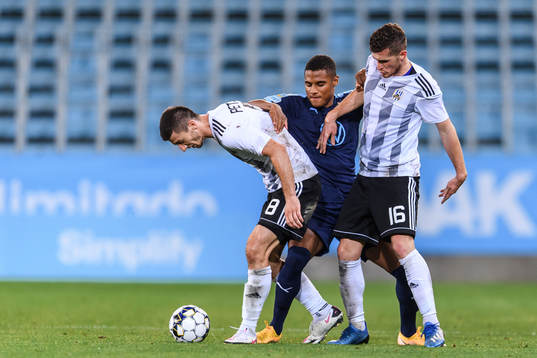 Amin Sarr of Malmö FF against Oliver Petrak and Jon