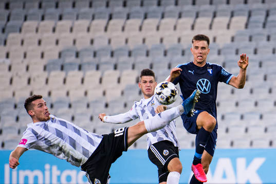 Jonas Knudsen of Malmö FF in action against Jon Mersinaj