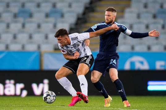 Indrit Tuci of Lokomotiva Zagreb and Lasse Nielsen of
