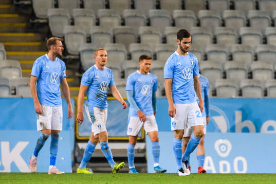 Adi Nalic of Malmö FF looks dejected with teammates