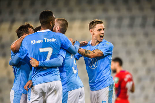 Sören Rieks and Isaac Kiese Thelin celebrate with Jo Inge