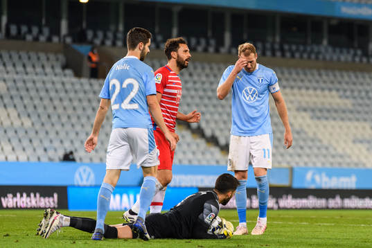 Ola Toivonen and Adi Nalic of Malmö FF against goalkeeper