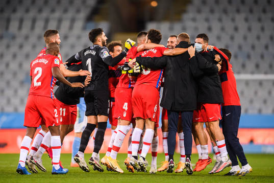 Players of Granada celebrate