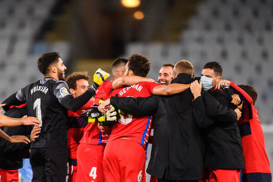 Players of Granada celebrate