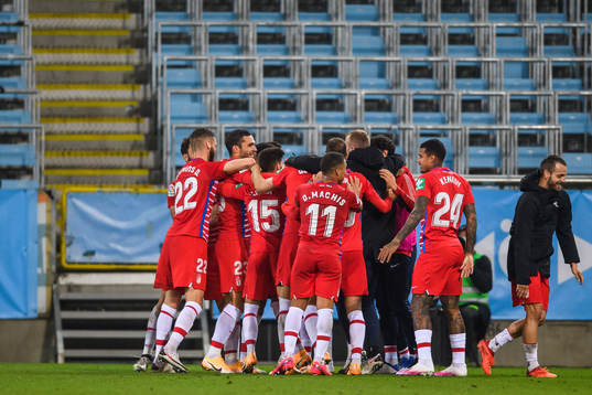 Players of Granada celebrate