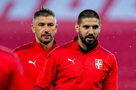 Aleksandar Kolarov and Aleksandar Mitrović of the Serbian