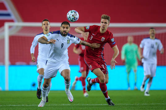 Aleksandar Mitrovic of Serbia and Kristoffer Ajer of Norway