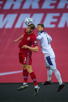 Kristoffer Ajer of Norway and Nemanja Maksimovic of Serbia