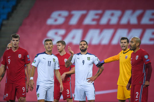 Darko Lazovic and Aleksandar Mitrovic of Serbia against