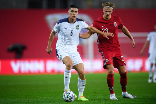 Nikola Milenkovic of Serbia and Erling Braut Haaland of