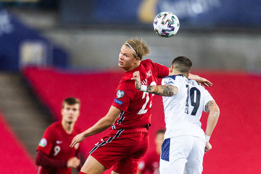 Erling Braut Haaland of Norway and Mihailo Ristic of Serbia