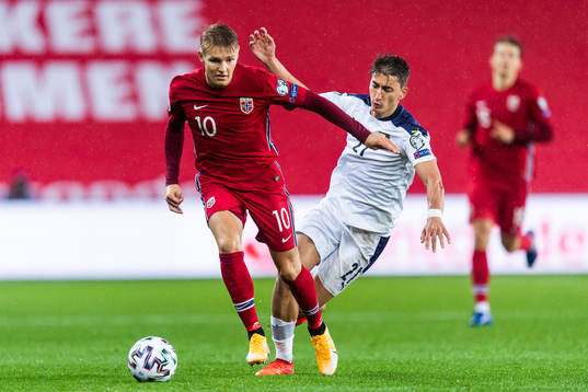 Martin Ødegaard of Norway and Filip Djuricic of Serbia