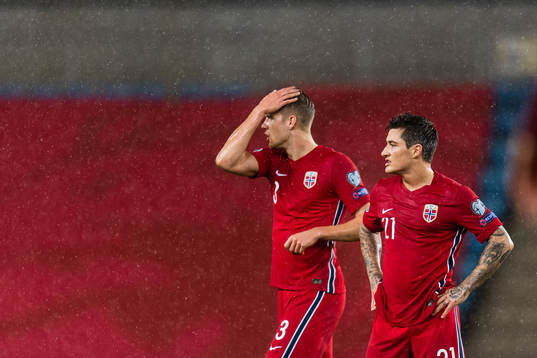 Kristoffer Ajer and Mathias Normann of Norway look dejected
