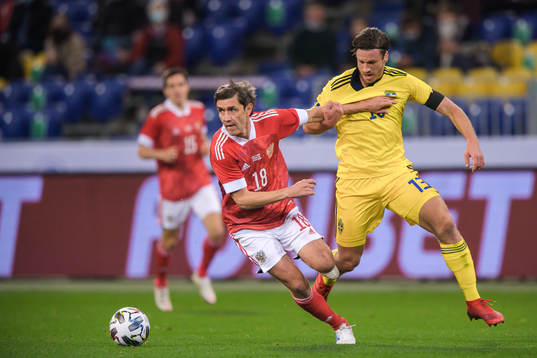 Yuri Zhirkov of Russia and Gustav Svensson of Sweden