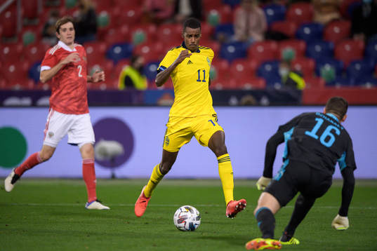 Alexander Isak of Sweden and goalkeeper Soslan Dzhanaev of