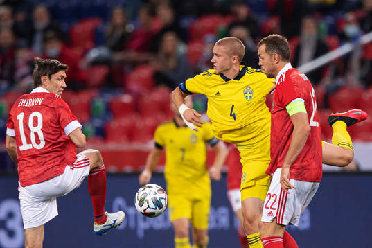Yuri Zhirkov and Artem Dzyuba of Russia are being