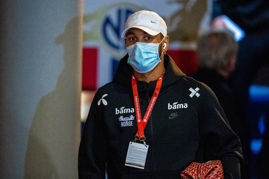Joshua King of Norway arrives wearing a face mask