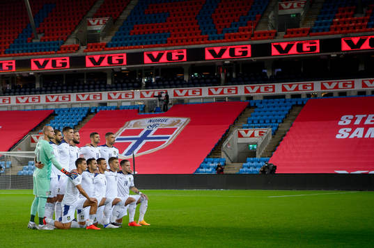 The starting eleven of Serbia pose for a team photo ahead
