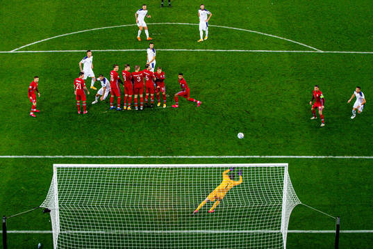 Aleksandar Kolarov of Serbia takes a freekick