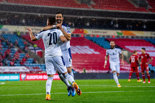 Sergej Milinkovic-Savic of Serbia celebrates with teammate