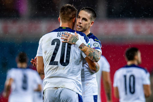 Sergej Milinkovic-Savic of Serbia celebrates with teammate