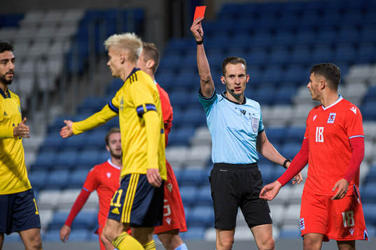 Yannis Dublin of Luxembourg receives a red card from