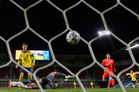 Max Svensson of Sweden scores the 2-0 goal behind