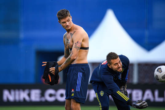 Mikael Lustig and goalkeeper Kristoffer Nordfeldt of the