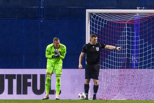 Goalkeeper Robin Olsen of Sweden in pain