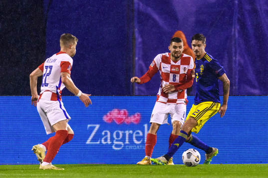 Mikael Lustig of Sweden and Mateo Kovacic of Croatia