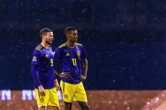 Marcus Berg and Alexander Isak of Sweden look dejected