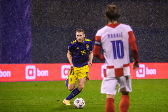 Dejan Kulusevski of Sweden and Luka Modric of Croatia