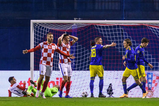 Nikola Vlasic and Filip Uremovic of Croatia looks dejected
