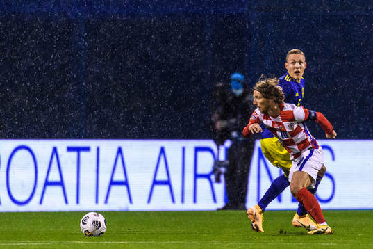 Ludwig Augustinsson of Sweden and Luka Modric of Croatia