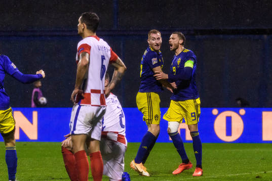 Dejan Kulusevski and Marcus Berg of Sweden celebrate