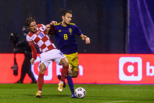 Luka Modric of Croatia and Albin Ekdal of Sweden -during