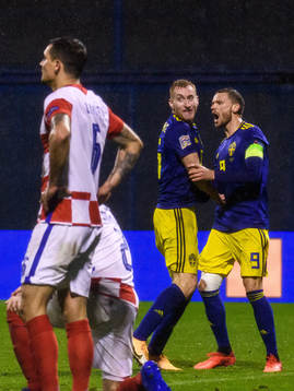 Dejan Kulusevski and Marcus Berg of Sweden celebrate