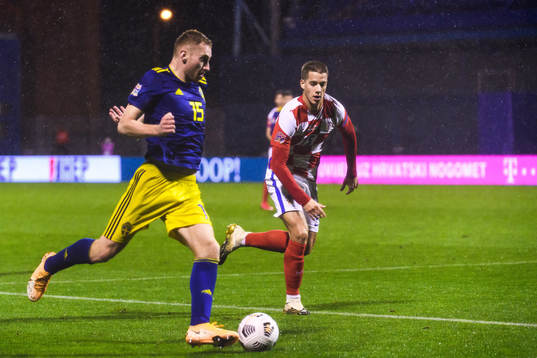 Dejan Kulusevski of Sweden and Mario Pasalic of Croatia