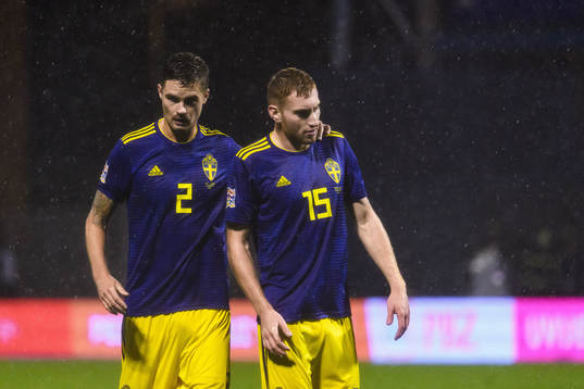 Mikael Lustig and Dejan Kulusevski of Sweden look dejected