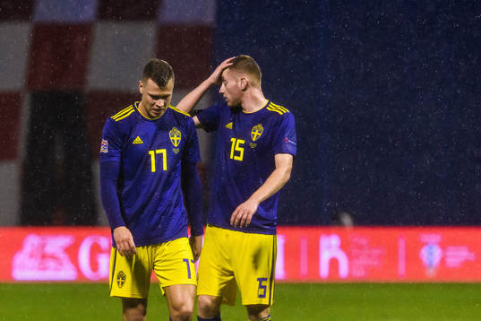 Viktor Claesson and Dejan Kulusevski of Sweden look dejected