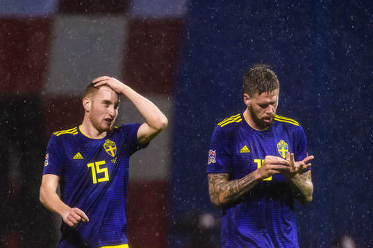 Dejan Kulusevski and Pontus Jansson of Sweden looks dejected