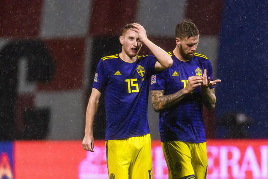 Dejan Kulusevski and Pontus Jansson of Sweden looks dejected