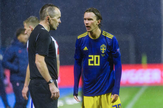 Kristoffer Olsson of Sweden speaks with the referee John