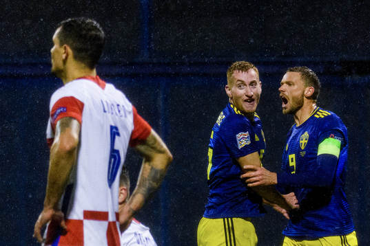 Marcus Berg celebrates with Dejan Kulusevski of Sweden