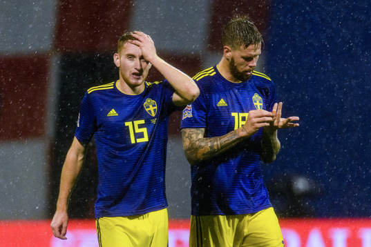 Dejan Kulusevski and Pontus Jansson of Sweden looks dejected