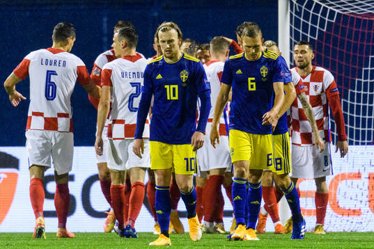 Emil Forsberg and Ludwig Augustinsson of Sweden looks