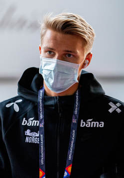 Martin Ødegaard of Norway arrives wearing a face mask